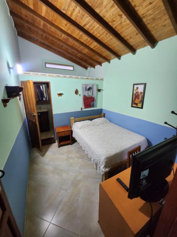 Postel nebo postele na pokoji v ubytování Hotel Atenas Jericó