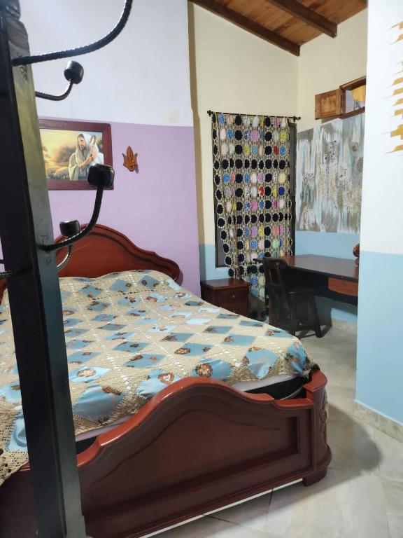 Postel nebo postele na pokoji v ubytování Hotel Atenas Jericó