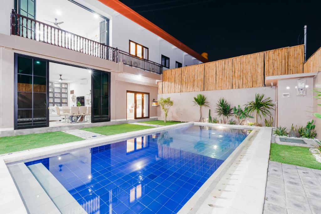 a swimming pool in the backyard of a house at Villa Crystal 9b in Seminyak