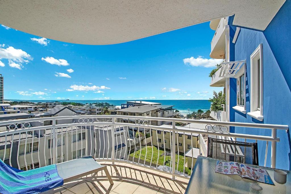 a balcony with a view of the ocean at Myconos Resort in Maroochydore
