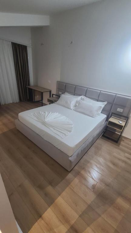 Postel nebo postele na pokoji v ubytování Hotel Noel