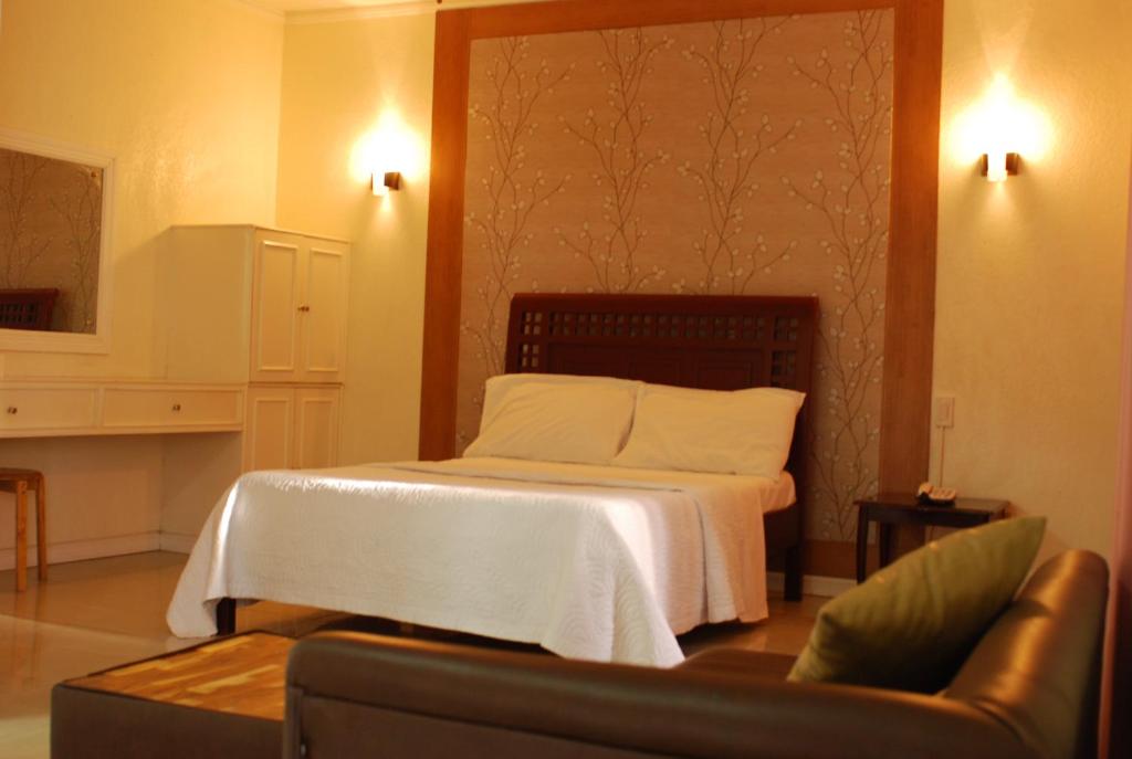 Postel nebo postele na pokoji v ubytování shillahotel and resort