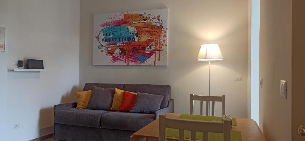a living room with a couch and a table at A casa di Emi e Giò in Rome