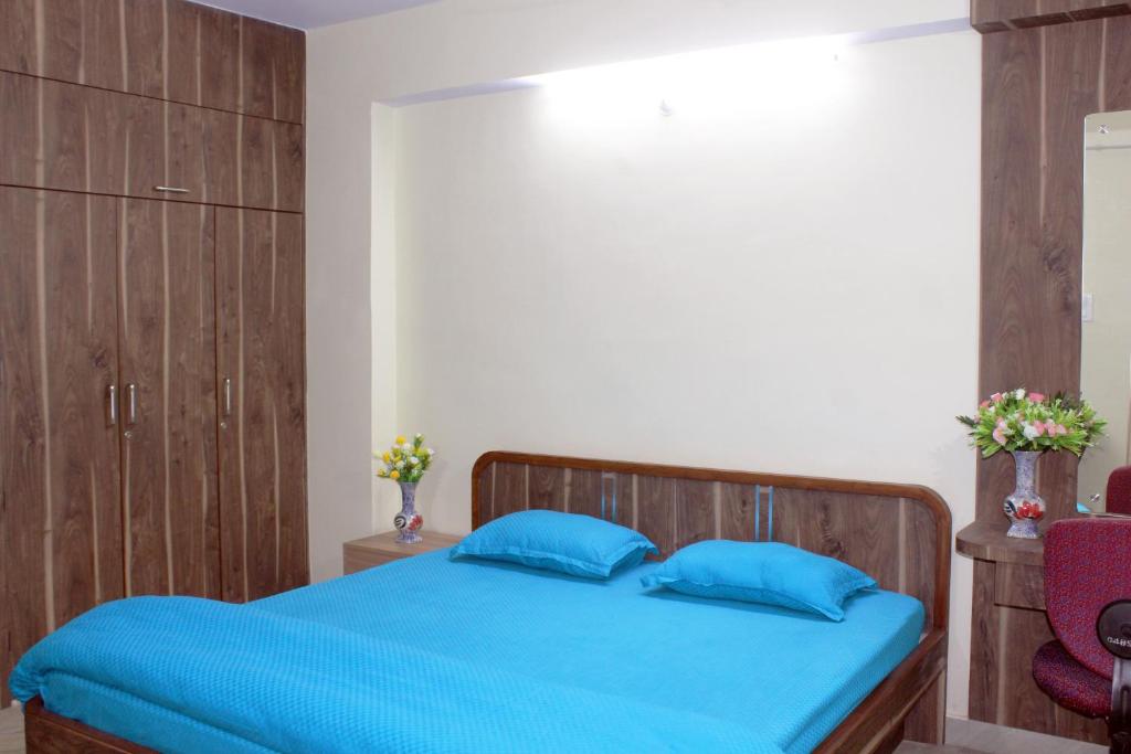 Postel nebo postele na pokoji v ubytování Sikaria Homes