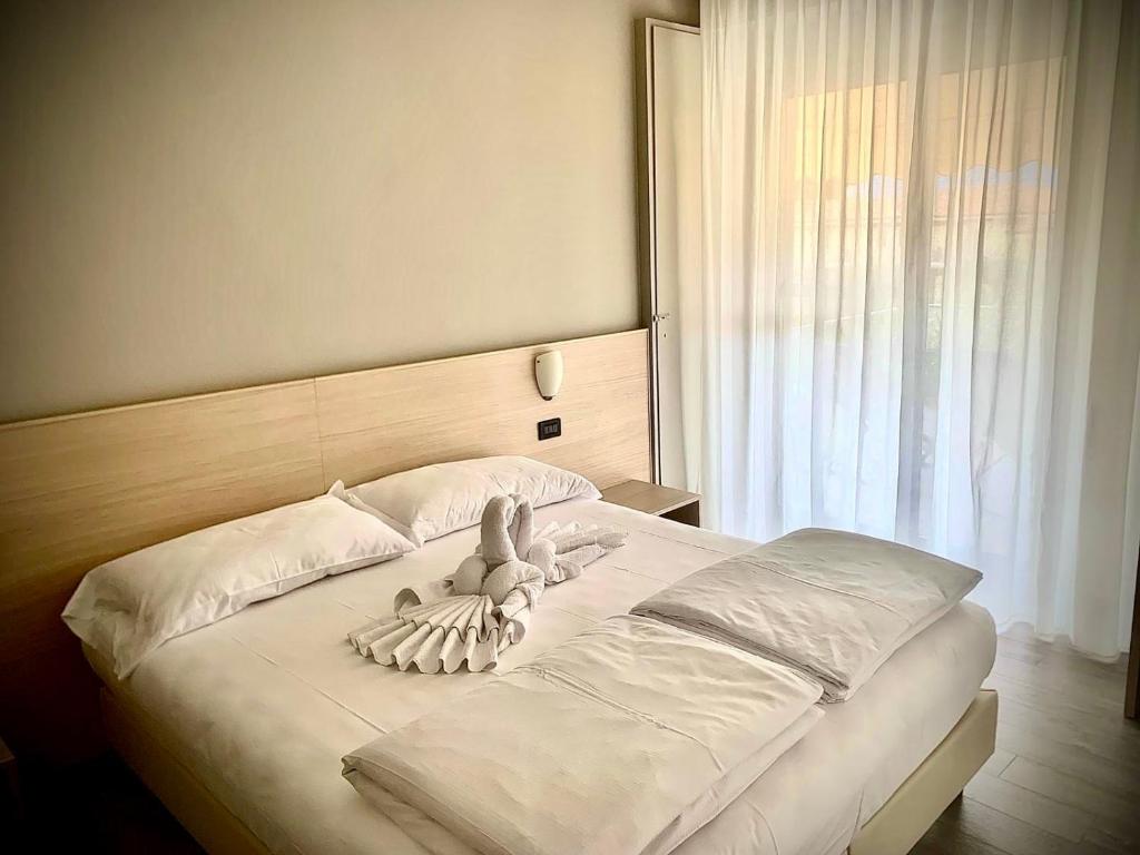 Postel nebo postele na pokoji v ubytování Hotel Astoria