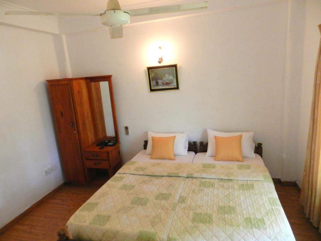 Postel nebo postele na pokoji v ubytování Paradise Inn