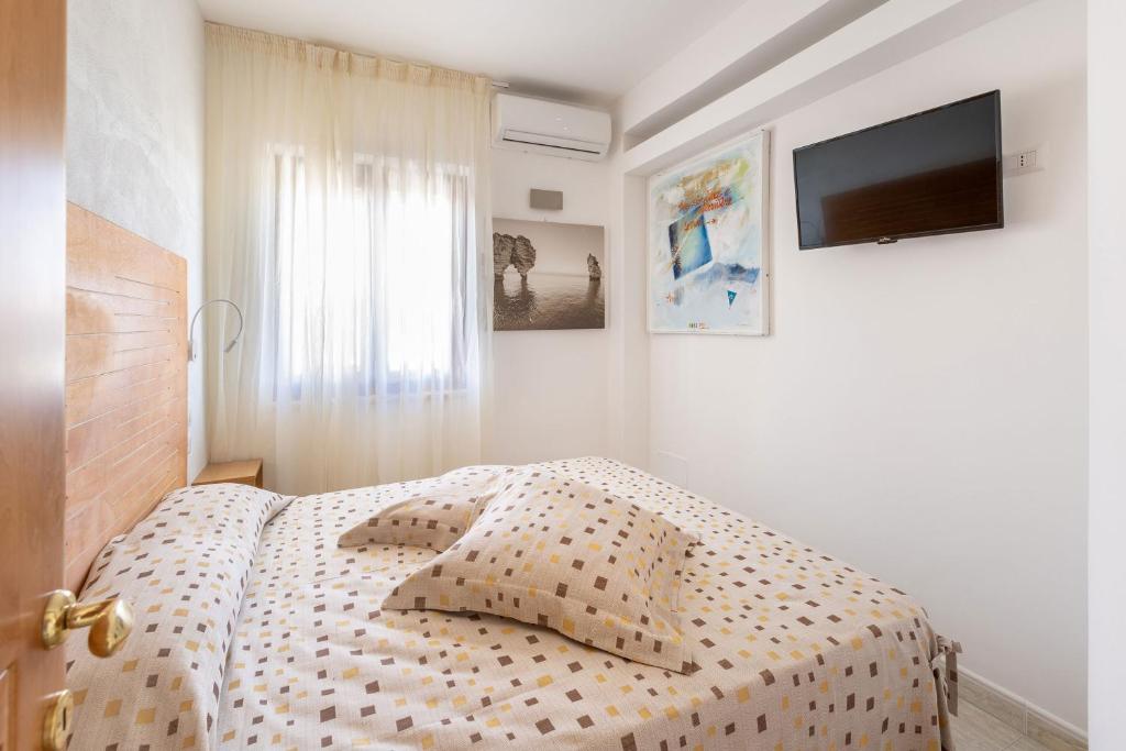 A bed or beds in a room at A Casa di Anna by BarbarHouse