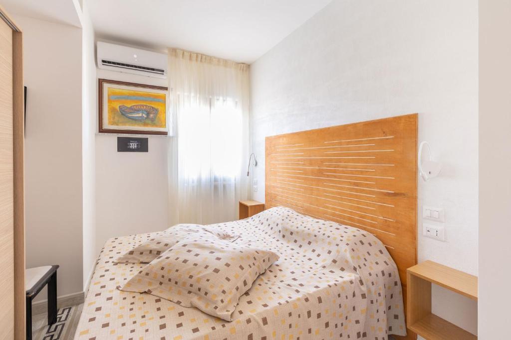 A bed or beds in a room at A Casa di Anna by BarbarHouse
