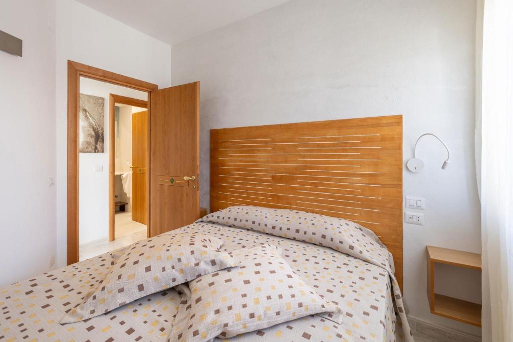 A bed or beds in a room at A Casa di Anna by BarbarHouse