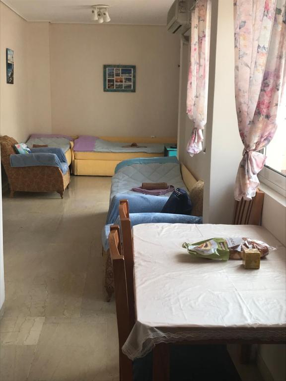 Postel nebo postele na pokoji v ubytování Loutraki Vacation