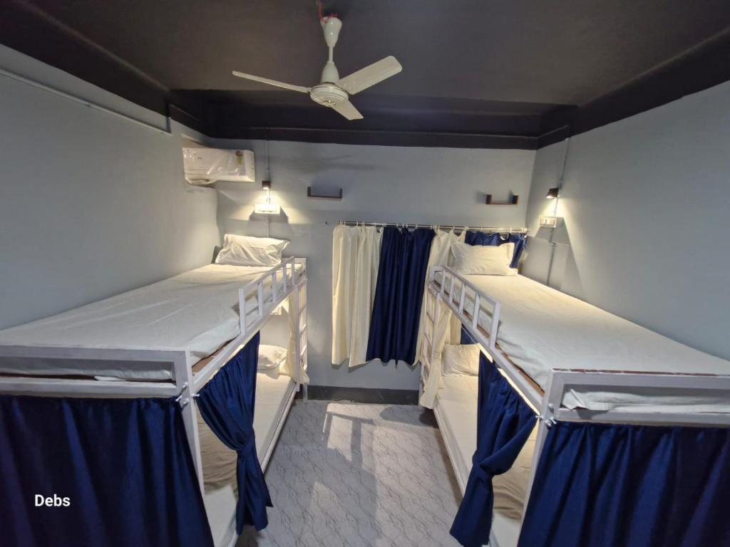 Postel nebo postele na pokoji v ubytování Faith Dorms