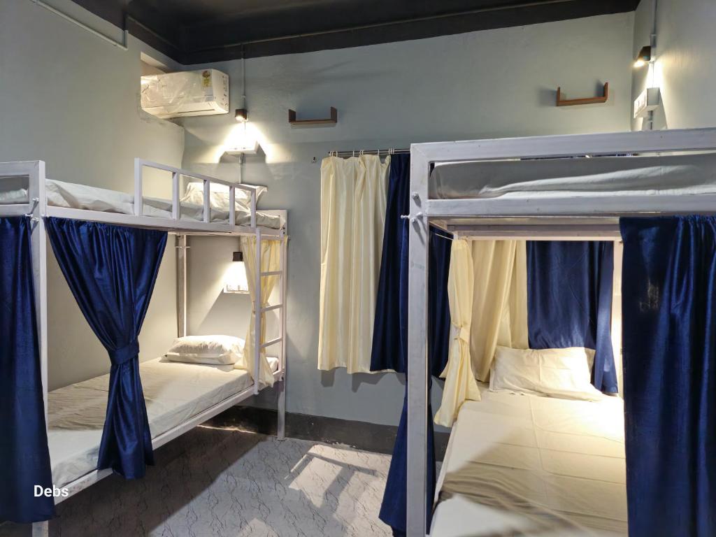 Postel nebo postele na pokoji v ubytování Faith Dorms