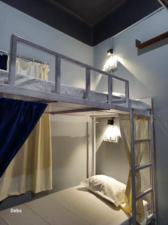 Postel nebo postele na pokoji v ubytování Faith Dorms