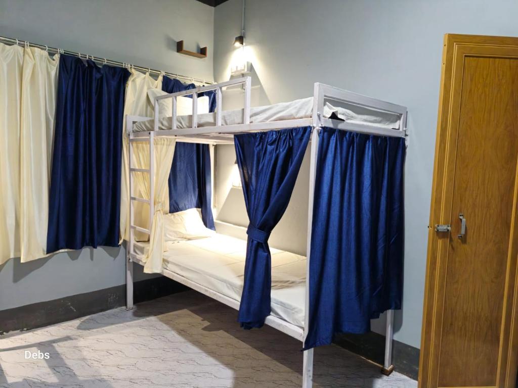 Postel nebo postele na pokoji v ubytování Faith Dorms