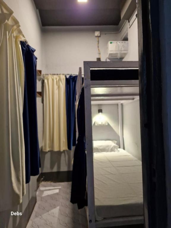 Postel nebo postele na pokoji v ubytování Faith Dorms