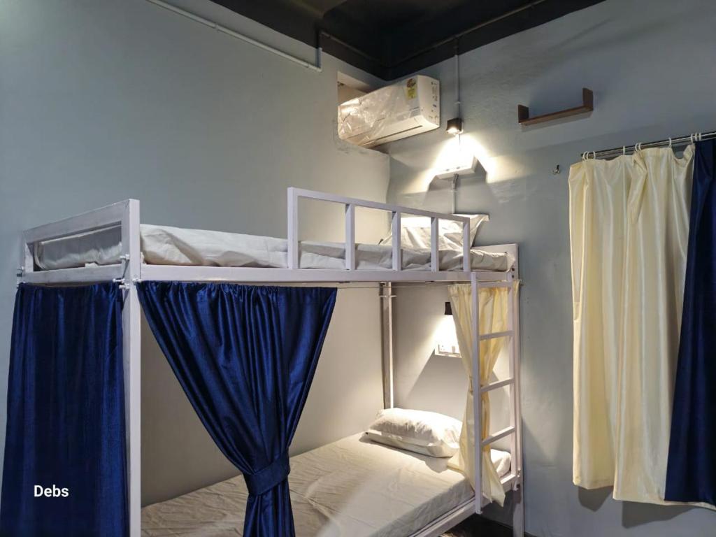 Postel nebo postele na pokoji v ubytování Faith Dorms