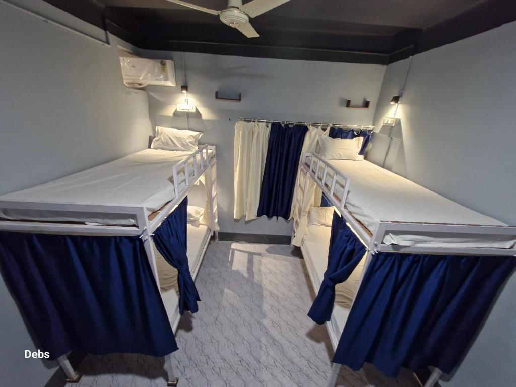 Postel nebo postele na pokoji v ubytování Faith Dorms