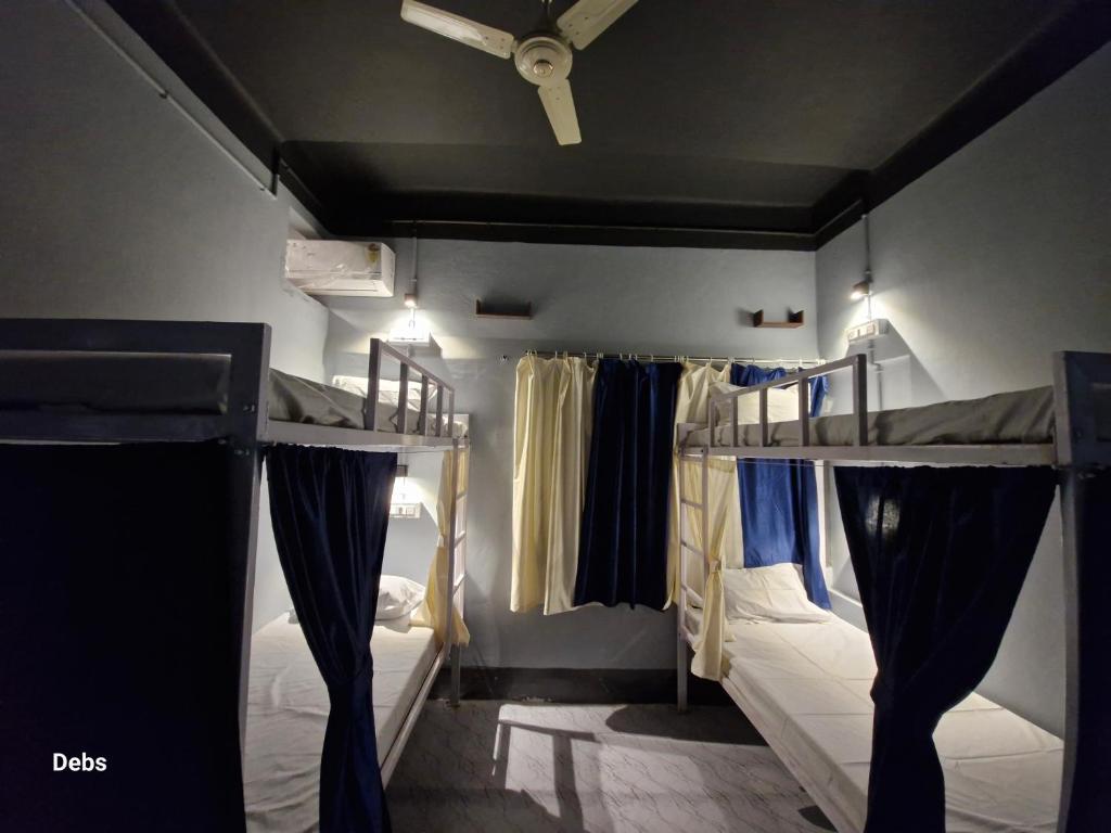 Postel nebo postele na pokoji v ubytování Faith Dorms