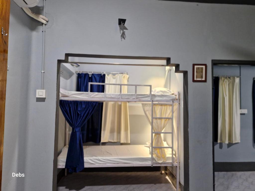 Postel nebo postele na pokoji v ubytování Faith Dorms