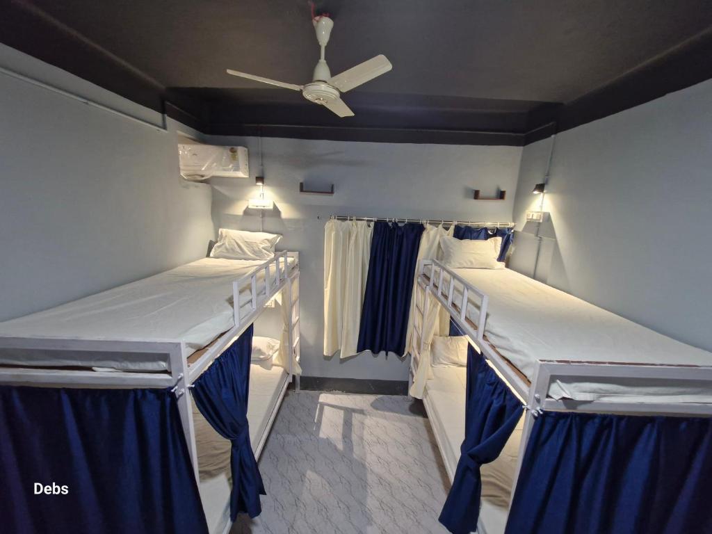 Postel nebo postele na pokoji v ubytování Faith Dorms