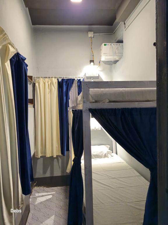 Postel nebo postele na pokoji v ubytování Faith Dorms