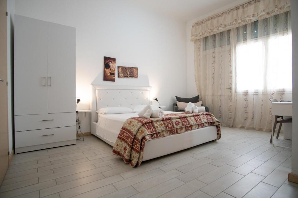 Postel nebo postele na pokoji v ubytování B&B ARCHIMEDE