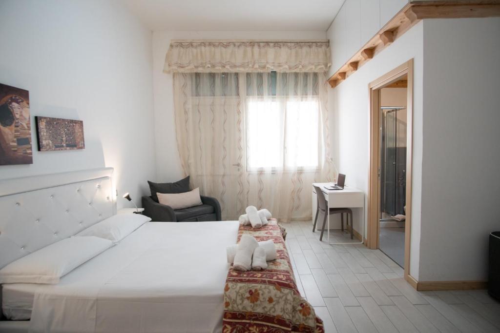 Postel nebo postele na pokoji v ubytování B&B ARCHIMEDE