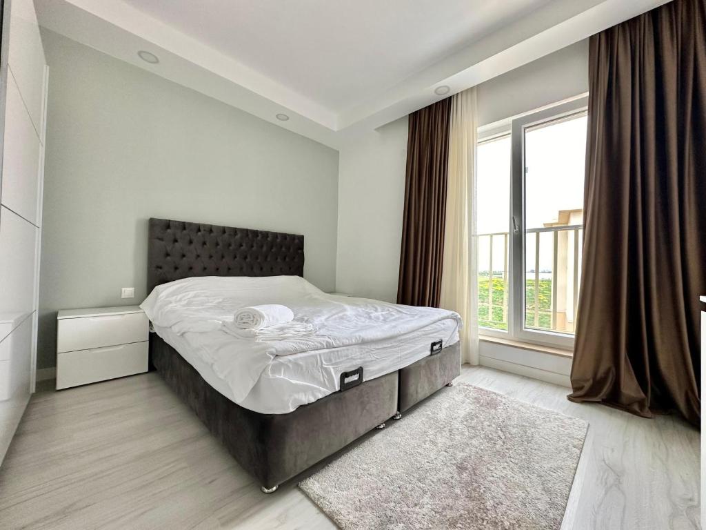 Postel nebo postele na pokoji v ubytování Double Studio A505 StayInn by Cosmopolis