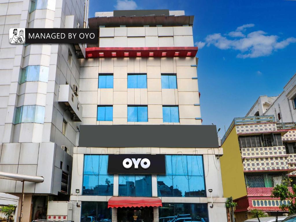 a building with an ovo sign on the side of it at Collection O Heritage VIP Road in Kolkata