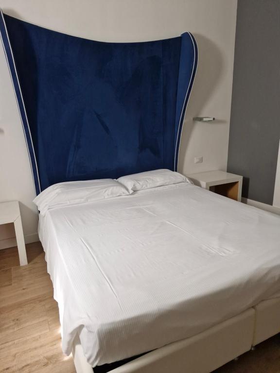 Postel nebo postele na pokoji v ubytování Hotel La Loggia