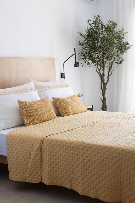 Postel nebo postele na pokoji v ubytování Olive Vista Suites