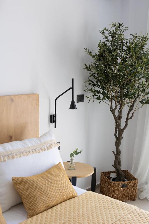 Postel nebo postele na pokoji v ubytování Olive Vista Suites