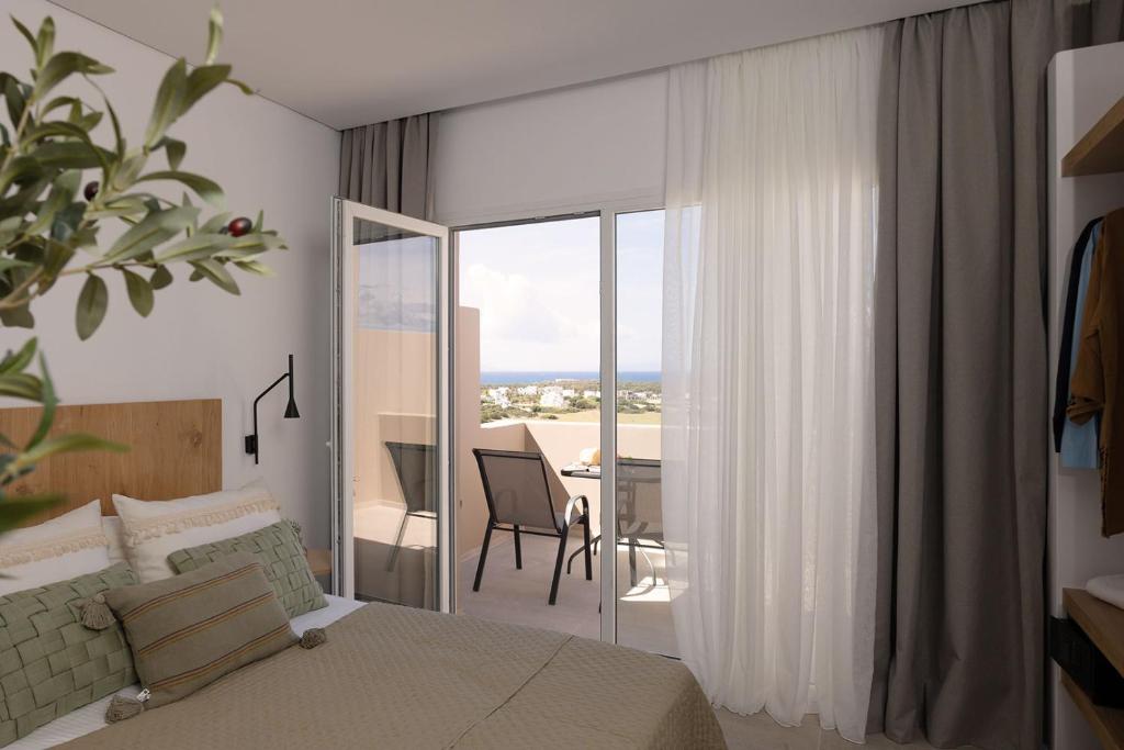Postel nebo postele na pokoji v ubytování Olive Vista Suites