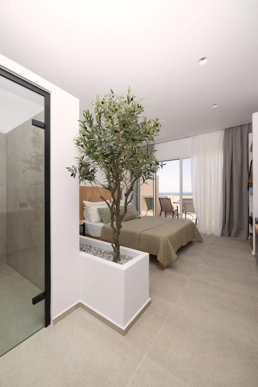 Postel nebo postele na pokoji v ubytování Olive Vista Suites