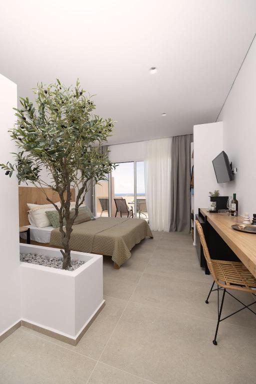 Postel nebo postele na pokoji v ubytování Olive Vista Suites
