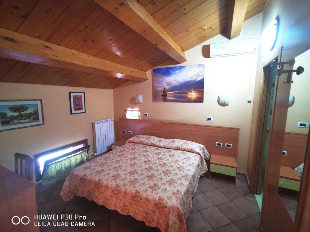 Postel nebo postele na pokoji v ubytování Porto Recanati Zimmer