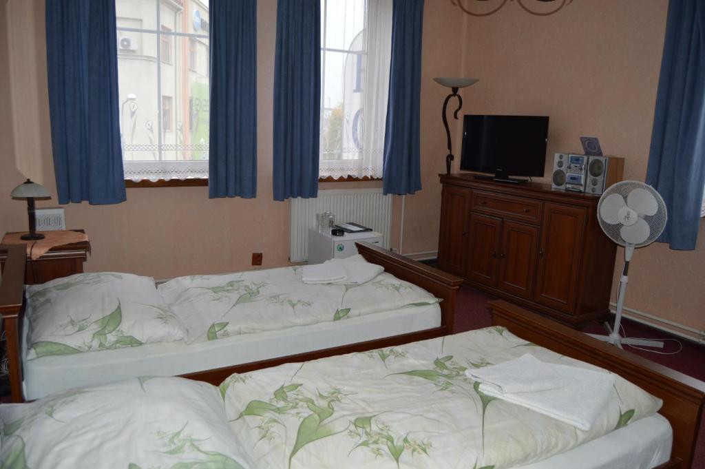 Postel nebo postele na pokoji v ubytování Hotel Paradise