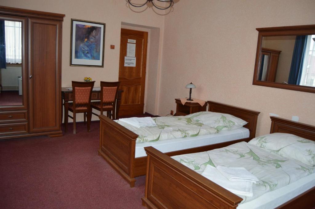 Postel nebo postele na pokoji v ubytování Hotel Paradise