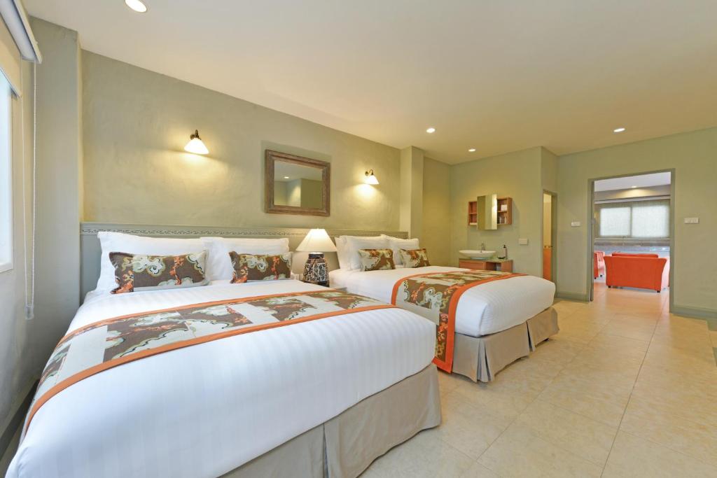Postel nebo postele na pokoji v ubytování Anantasila Beach Resort Hua Hin