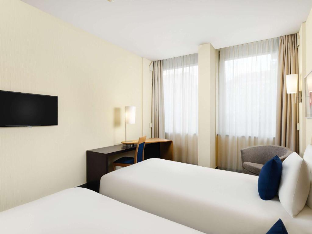 Postel nebo postele na pokoji v ubytování Novotel Budapest Danube