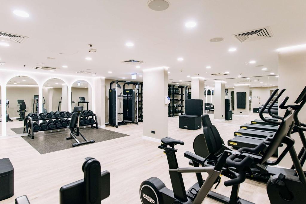 a gym with treadmills and elliptical machines at Hilton Imperial Dubrovnik in Dubrovnik