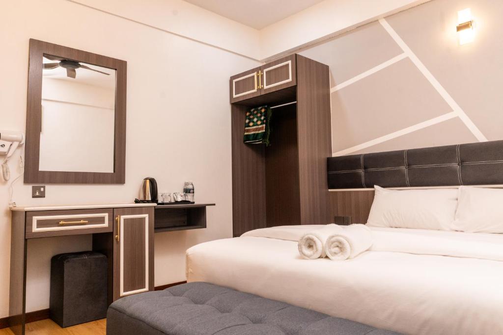 Rúm í herbergi á Sunrisestay