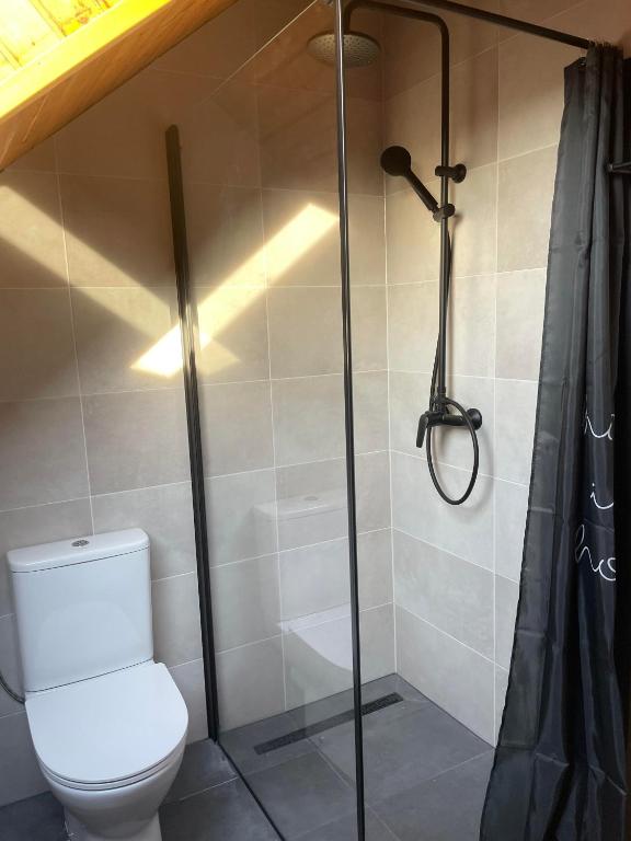 Kúpeľňa v ubytovaní Lelle Centrum Vendégház