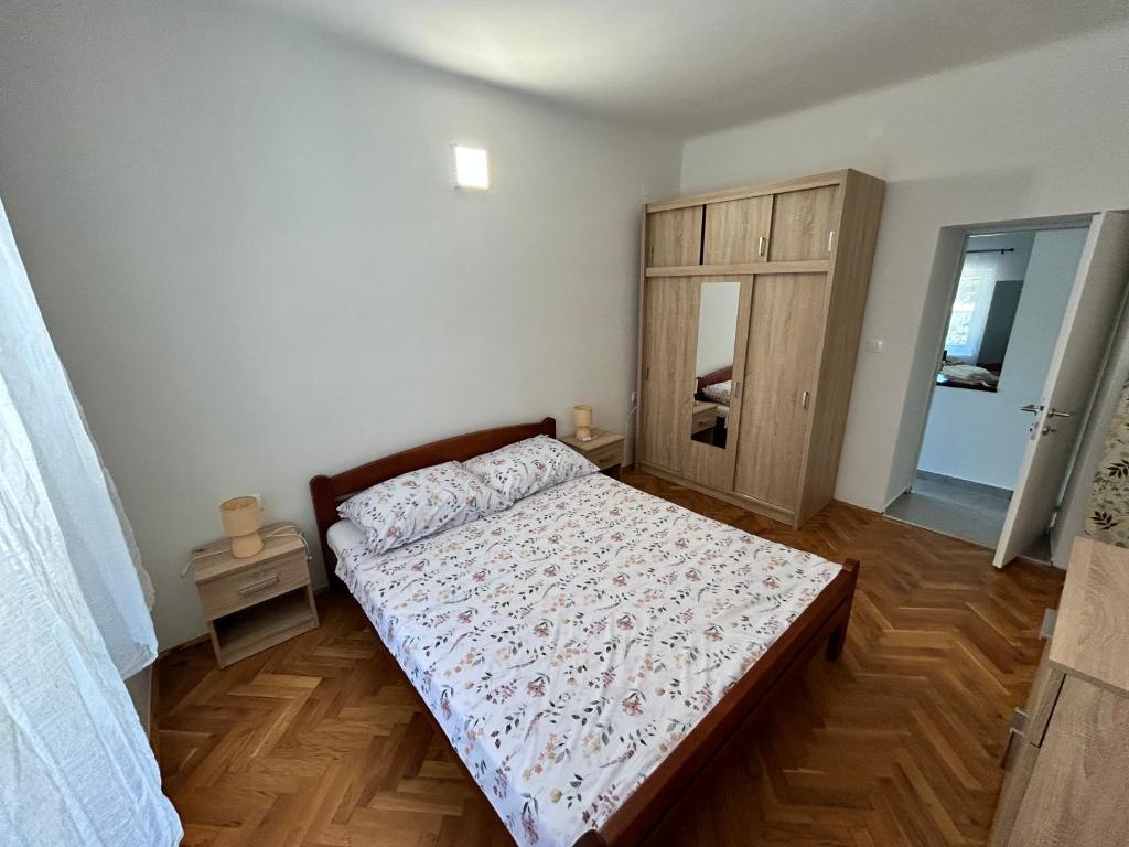 Кровать или кровати в номере Apartments Branko