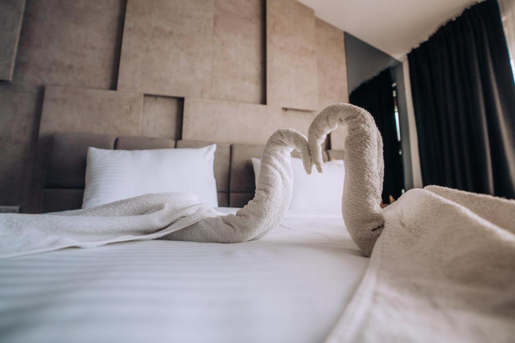 Postel nebo postele na pokoji v ubytování Hotel Aleksandrija