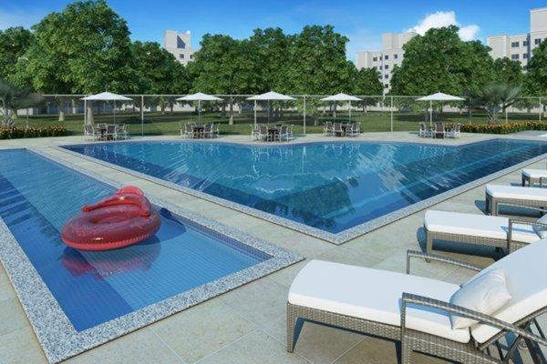 a large swimming pool with a red frisbee on it at Apartamento 2 Quartos Condomínio Clube 2 Vagas Garagem in Curitiba