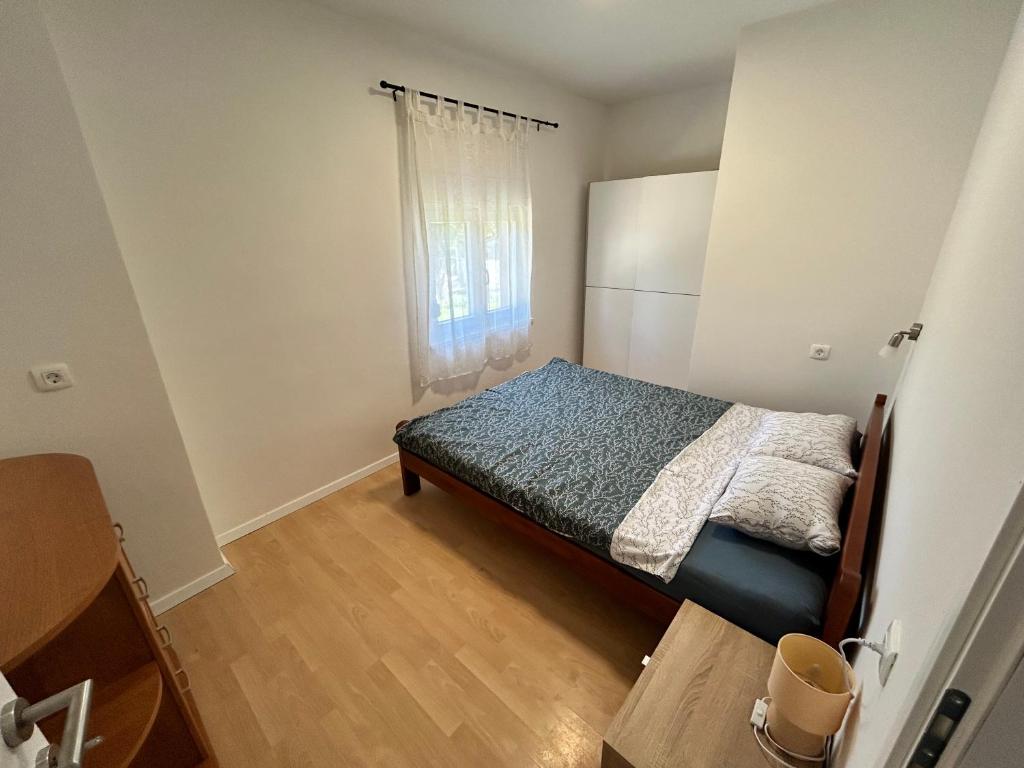 Кровать или кровати в номере Apartments Branko