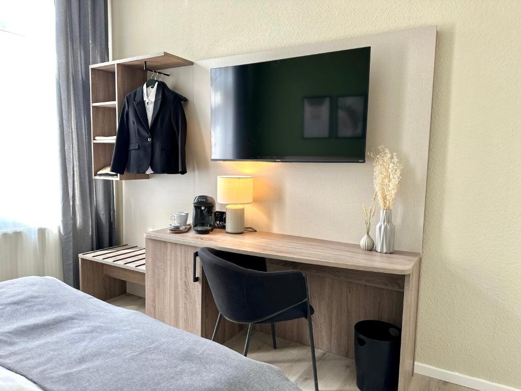 Ein Bett oder Betten in einem Zimmer der Unterkunft City Hotel Hameln
