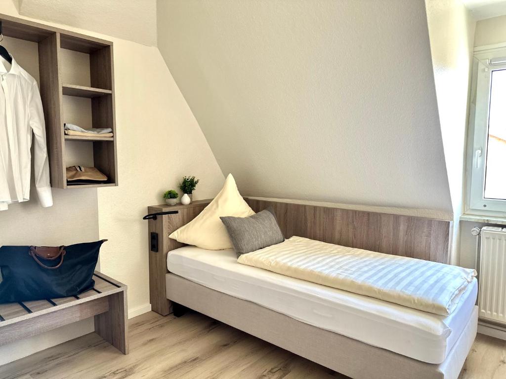 Ein Bett oder Betten in einem Zimmer der Unterkunft City Hotel Hameln