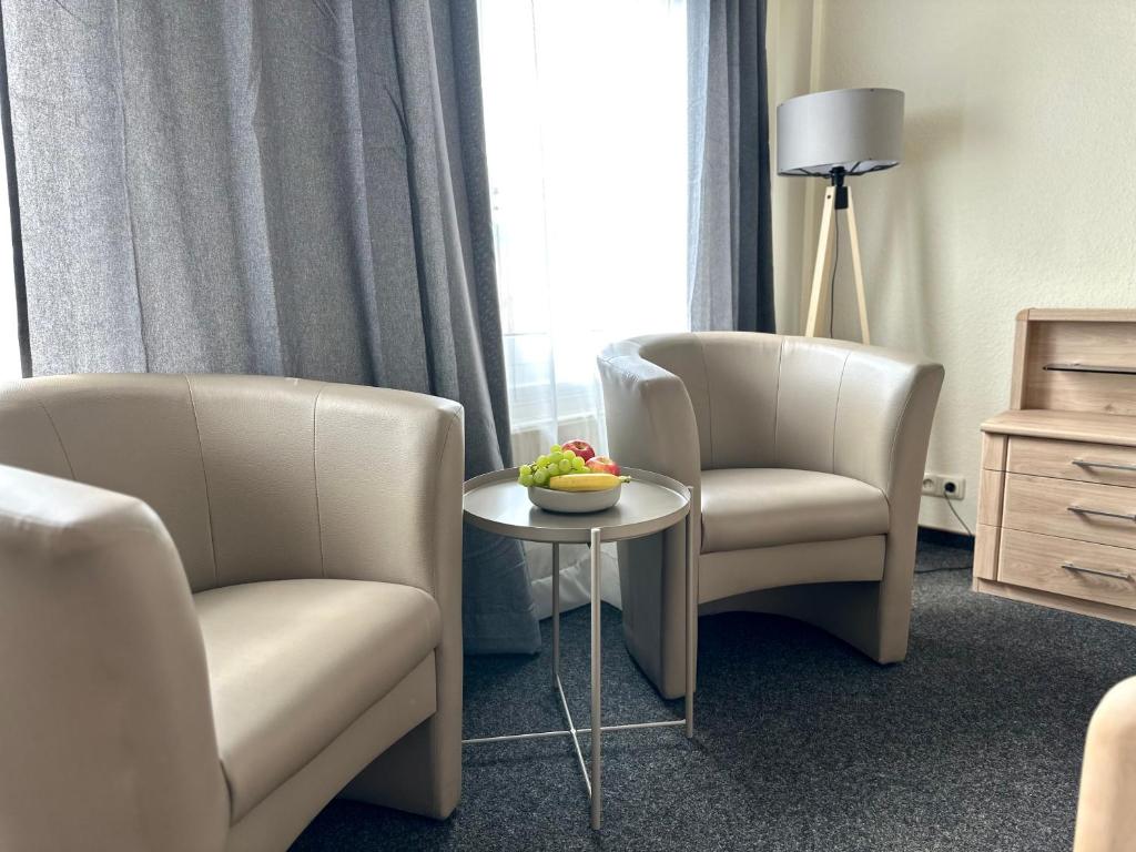 Ein Sitzbereich in der Unterkunft City Hotel Hameln